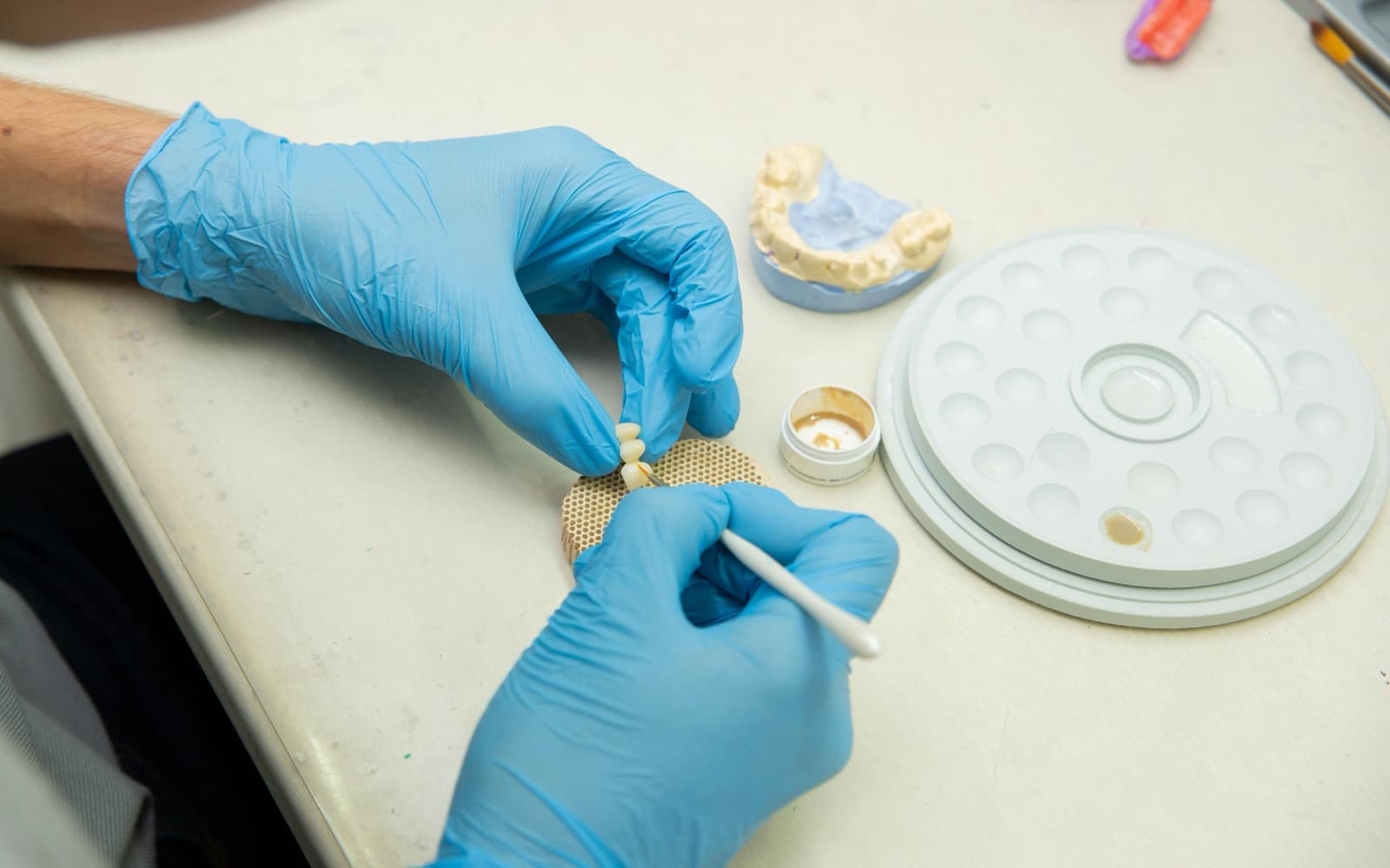 Hand-sculpted composite · ceramist at work